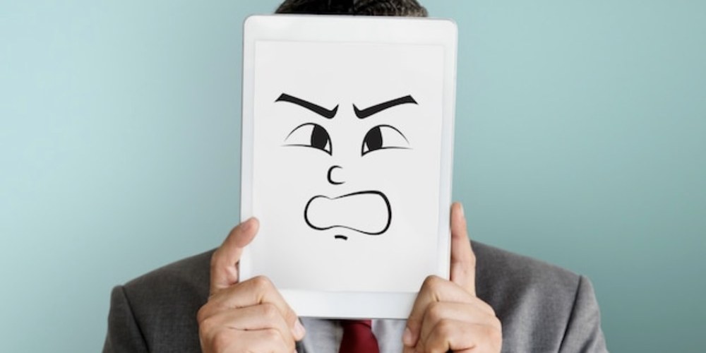 A person pausing to take a slow, steadying breath through frustration